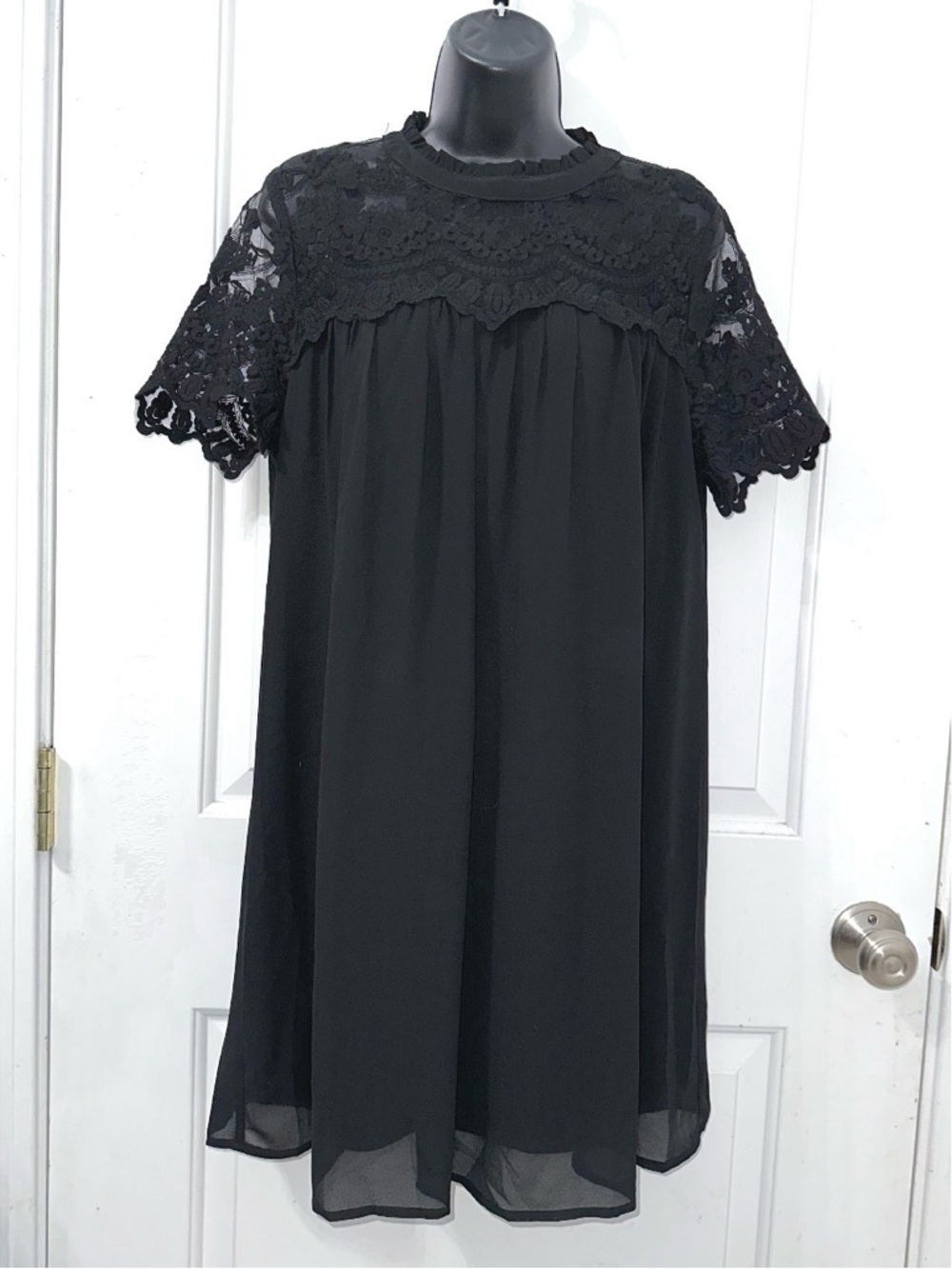 Entro black babydoll mini dress with a delicate lace yoke and short sleeves